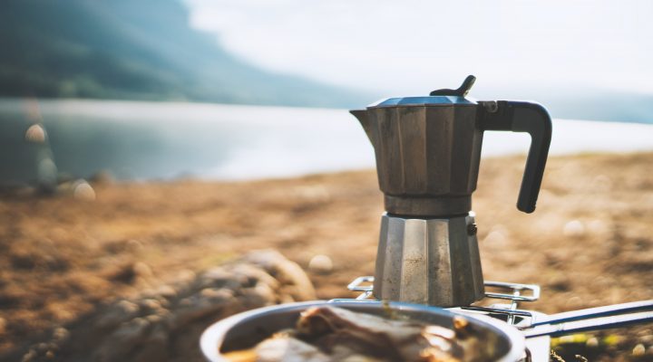 Coffee food prep by a lake while camping