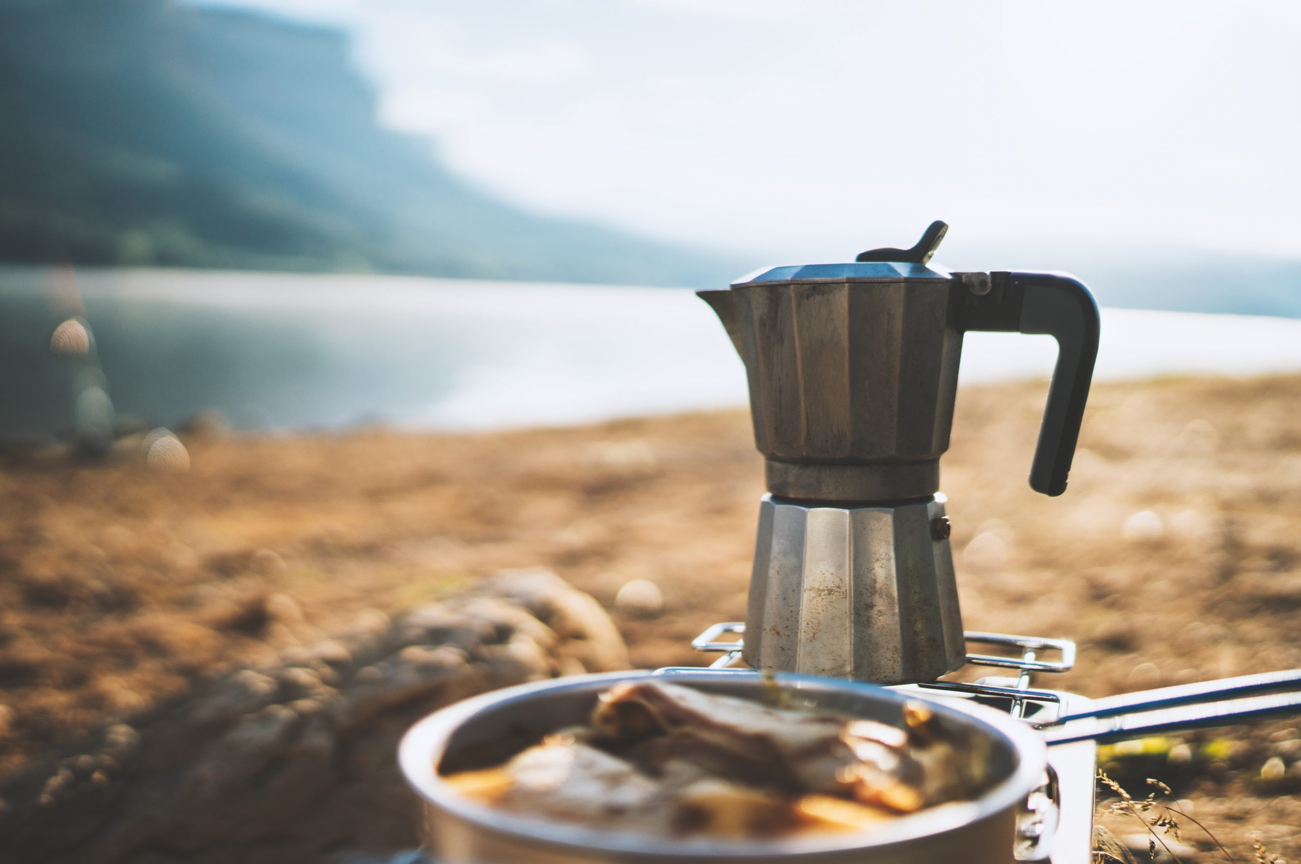 Coffee food prep by a lake while camping