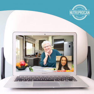 A picture of a laptop screen showing a client in their kitchen and dietitian on a video call with her