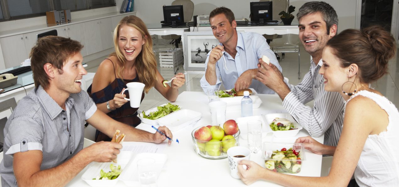 Employees eating together in a lunchroom