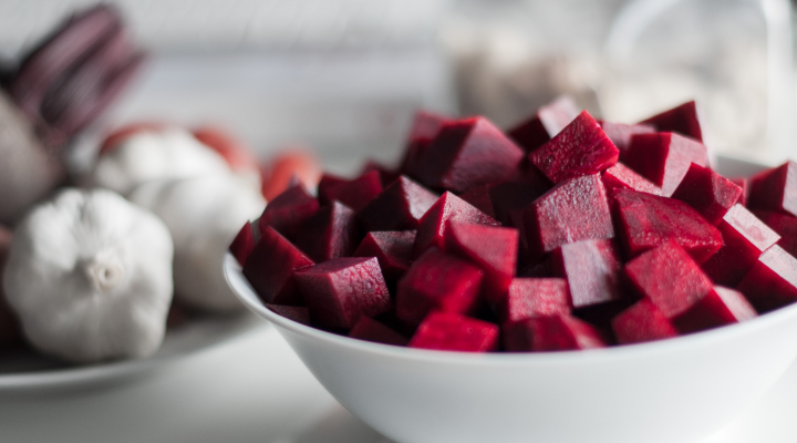 cubed beetroots in a white bowl