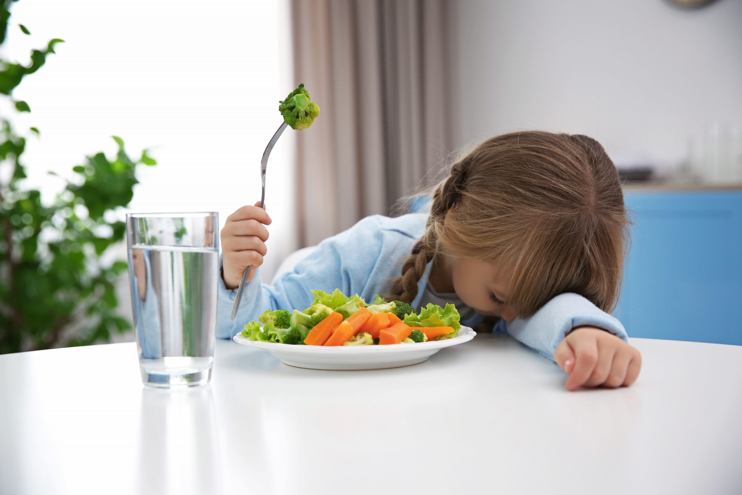 a picky eater not wanting to eat vegetables